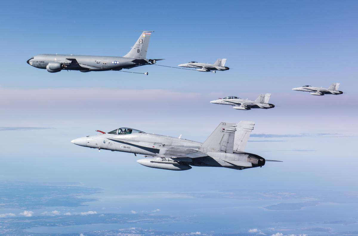 Four Finnish F/A-18 Hornet fighter jets and a U.S. KC-135 Stratotanker
