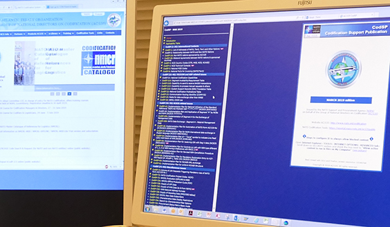 Two computer screens displaying nomenclature catalogues. Photo by Finnish Defence Forces.