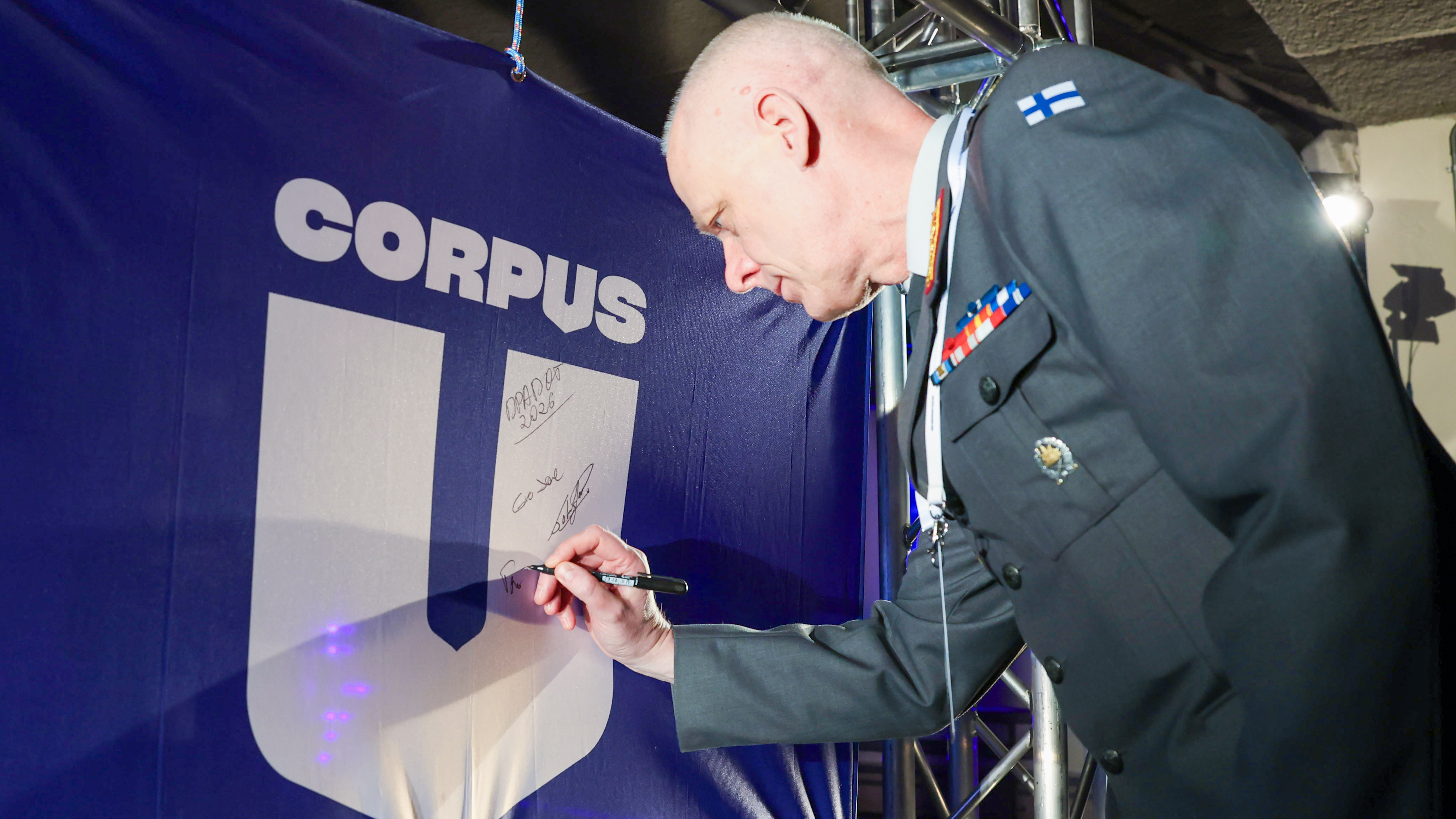 In the picture, Major General Tero Ylitalo, Director of the Defence Forces Logistics Command, signs the CORPUS banner.